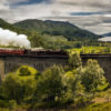 Enchanting-Travels-UK-Ireland-Tours-Panorama-of-Jacobite-steam-train-on-old-bridge-Scotland